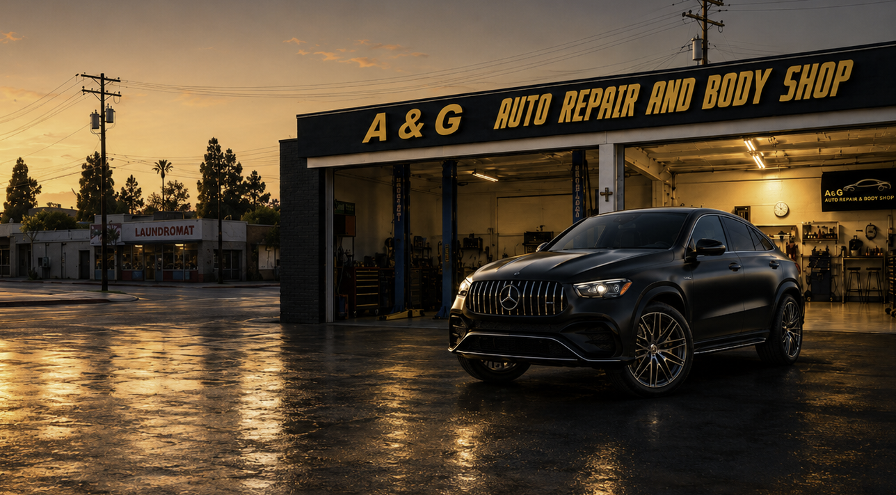 Black Mercedes coupe outside A&G Auto Repair and Body Shop at dusk